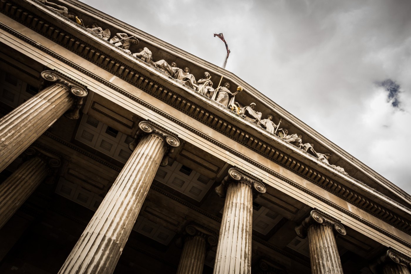 skyward view from ground of government building with tall pillars that resemble a courthouse and power of attorney legal documents and when they should be used other than aging parents photo credit abastian Pichler on Unsplash
